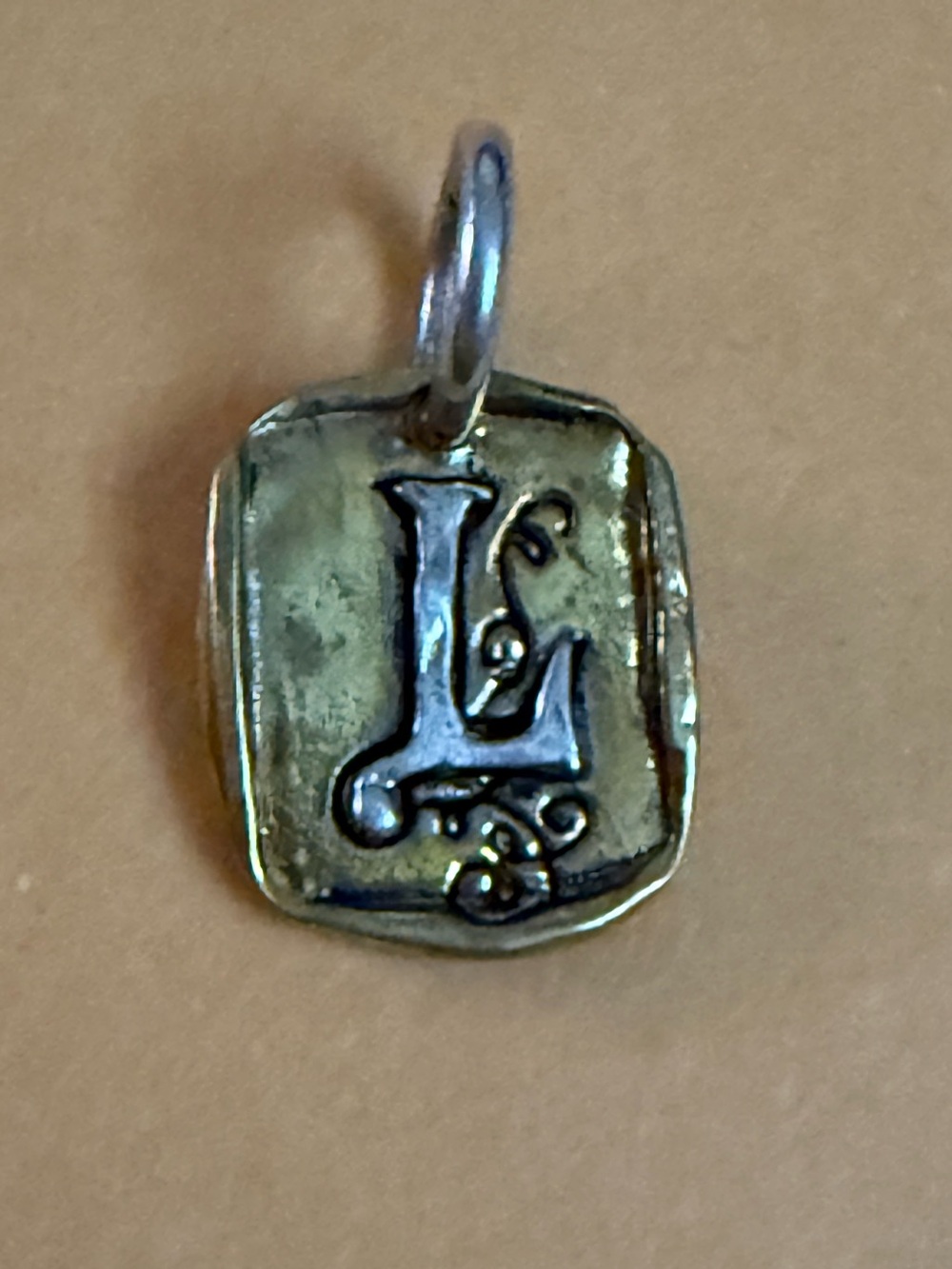 NWOT.  Waxing Poetic ‘L’ Charm